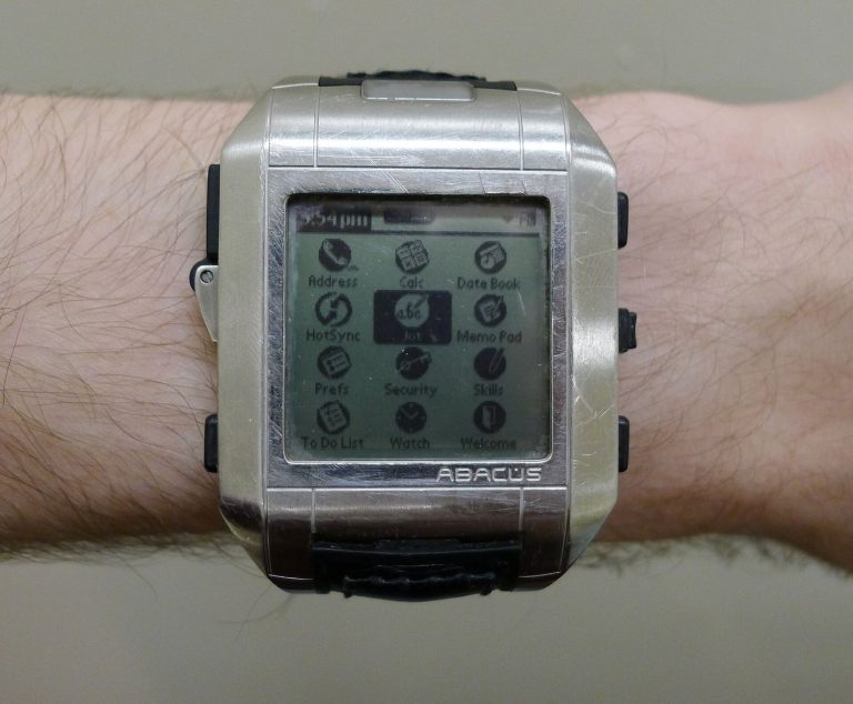 A smartwatch on a wrist showing health data